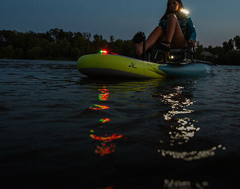 kayak on water with guardian angel safety light clipped to the end